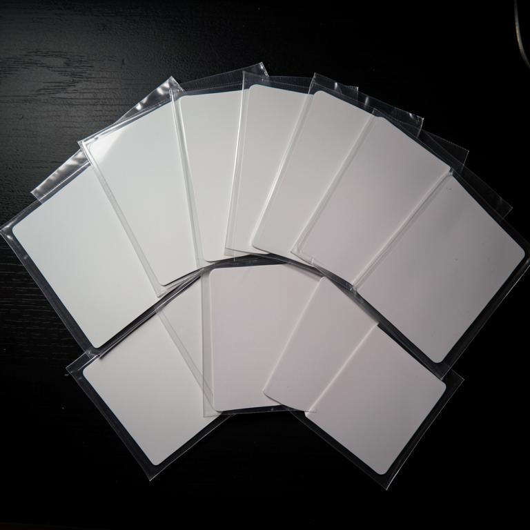 Blank trading cards in protective sleeves